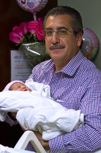 Alejandro Horcasitas Sr. holds his granddaughter Natasha for one of the first times. Natasha's parents are  2nd Lt. Daniel Horcasitas and Mayra Horcasitas 