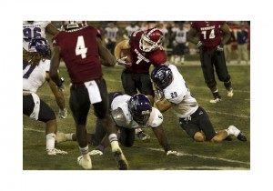 Aggies Wide Receiver Adam Shapiro fights for yards against ACU's defenders. 