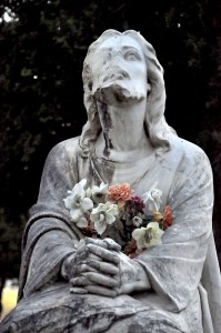 A very old statue of Jesus Christ in the middle of cemetery in Las Cruces, New Mexico.