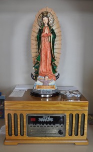 Virgen Mary, placed at the top of a vinyl turn table, is considered the best place to put her. That is where this family prays the Rosary. 