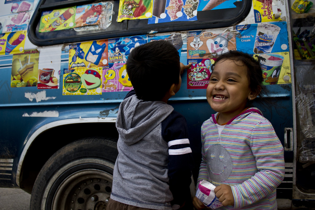 A candid moment in time. Joy and curiosity captured in one image beside an icecream truck in Hatch.
