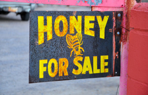 Sign advertising the sale of local honey in La Mesilla New Mexico.