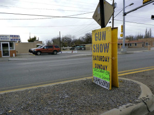 A gun show in the middle of town by the iconic Tulie Freeze burger joint.