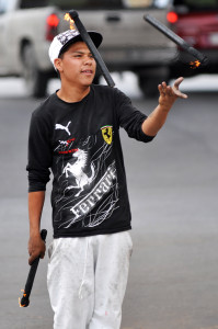 Alfredo Humberto Velásquez juggling fire torchers on the streets of Ciudad Juárez.
