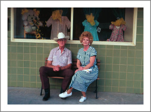 Couple sitting on bench in town of 75 people, Anson, Texas, 2003