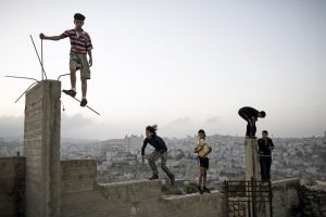 Boys playing on a hill overlooking Bethlehem. © Christopher Anderson, Palestine. Israel. 2007. 