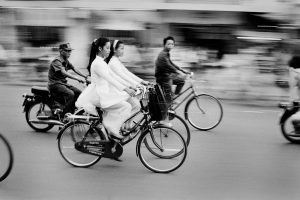Saigon's motorbike craze is one of the heralds of the Vietnam's cultural and economic rejuvenation. The morning commute finds young schoolgirls dressed in the traditional Ao Dai. Pre-communist fashions have made a big comeback since the late 1980s when the government began to loosen restrictions.