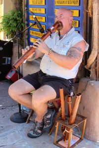 Rick May, 62, plays one of his four flutes in ABQ Old Town.