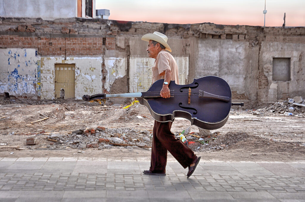 Musicians walking through downtown Juarez.